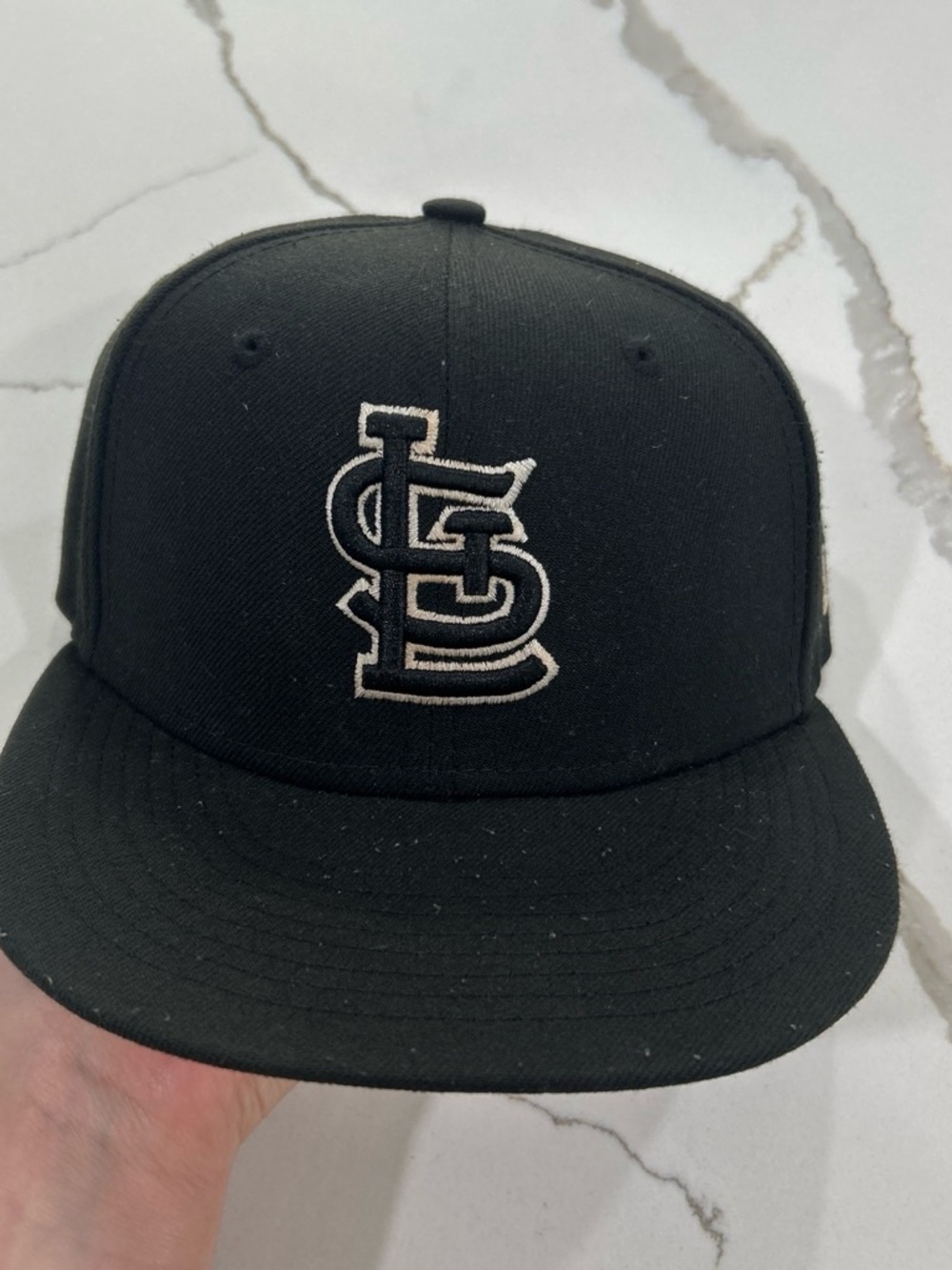 New Era Black Baseball Cap with White Embroidered Logo